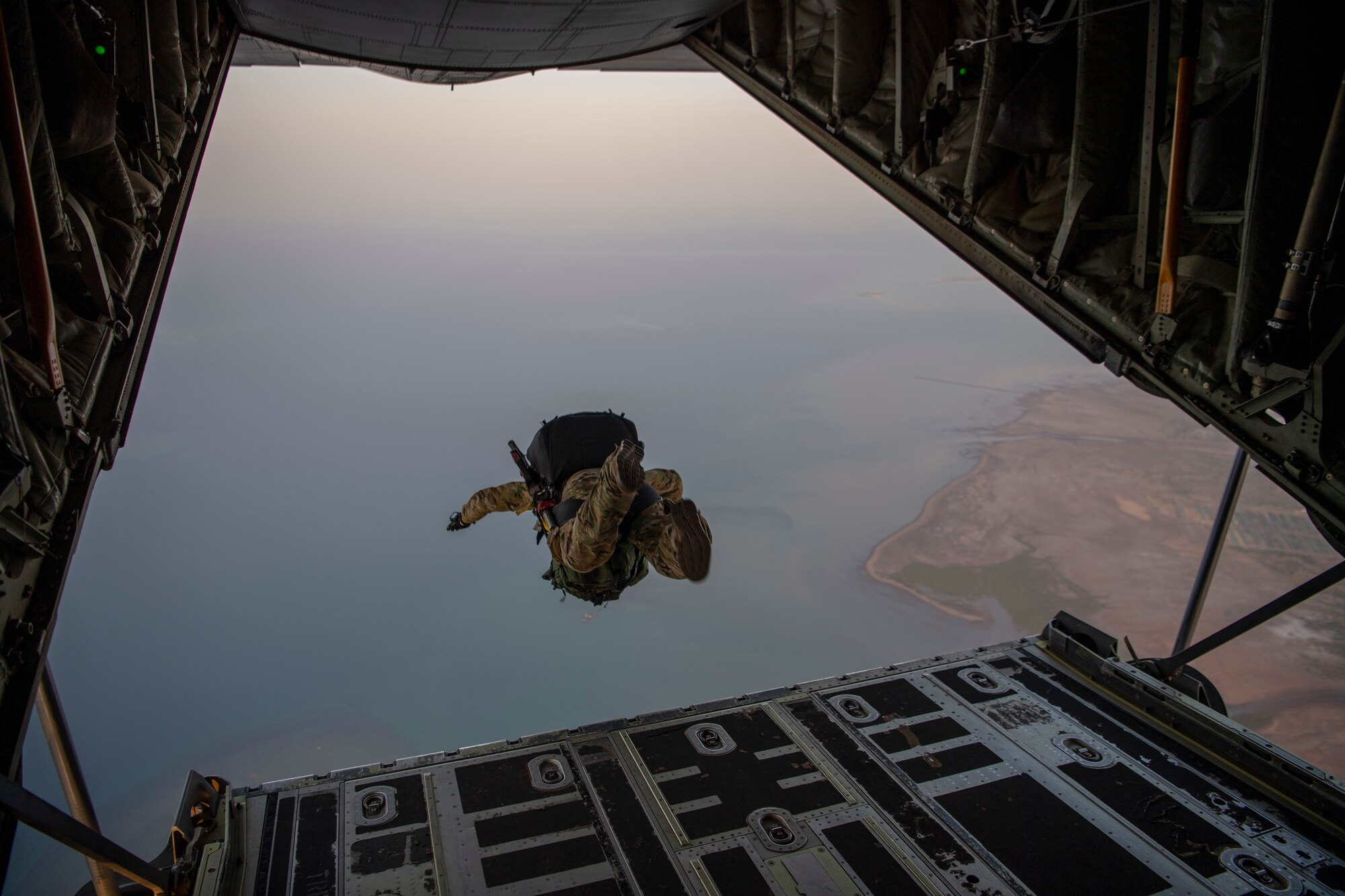 A person jumps from a plane