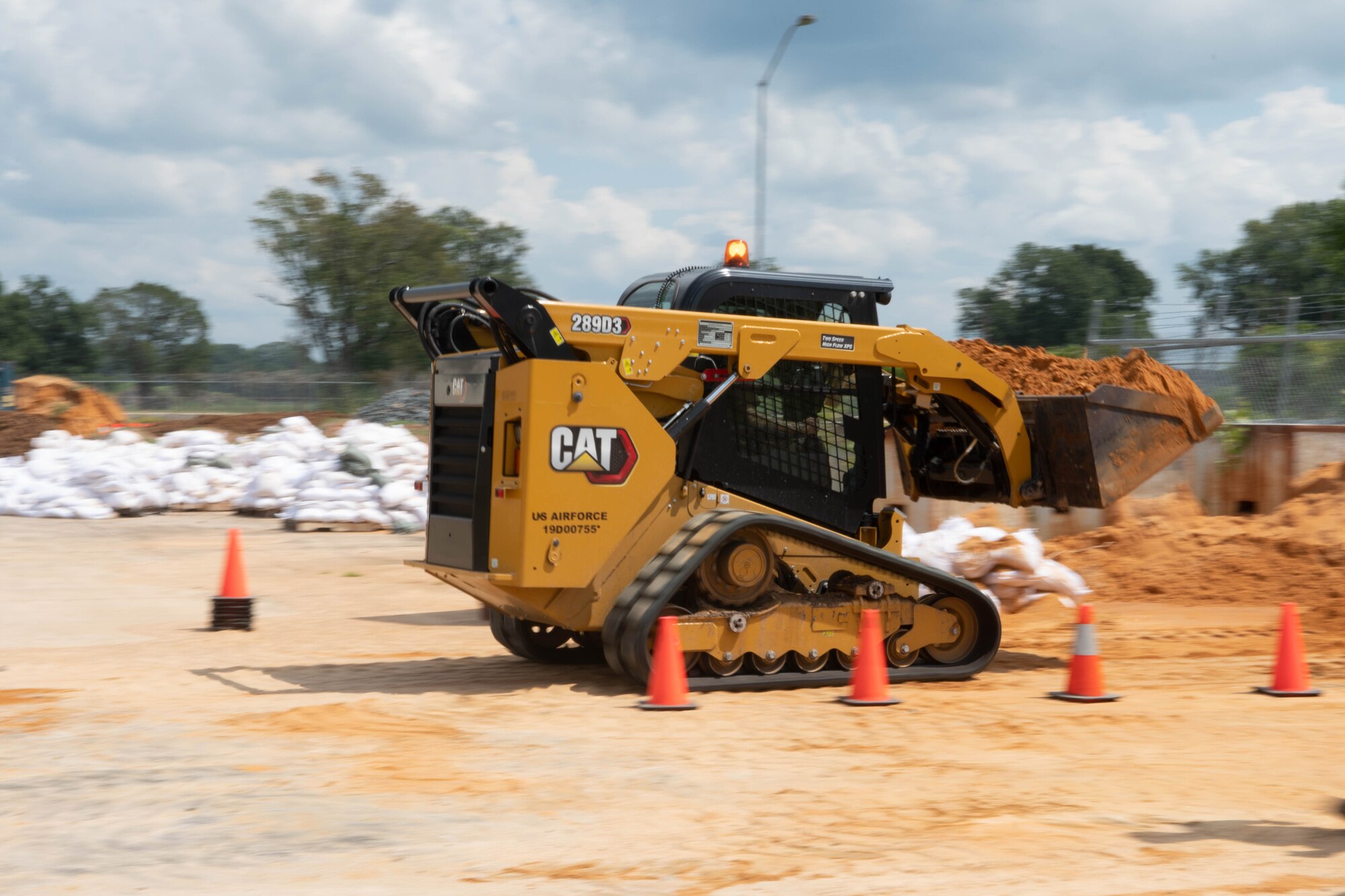 Heavy equipment moving with load of dirt