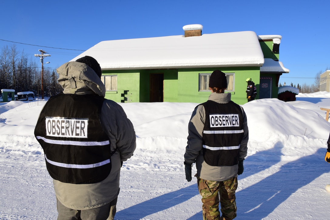 Research and development experts observe and evaluate the performance of search and extraction training at the Combined Arms Collective Training Facility, Fort Wainwright Alaska, Feb. 23 thru 25, 2020. The training was part of exercise Arctic Eagle 2020 - a statewide exercise designed to evaluate cold weather capabilities. (U.S. Air National Guard photo by Senior Airman Shannon Chace)