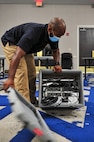 Kevin Rowe, a network administrator assigned to Joint Task Force Civil Support (JTF-CS), unpacks a deployable switch box during Vibrant Response 20 Lite.