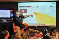Rick Vollman, the crisis action team chief assigned to Joint Task Force Civil Support (JTF-CS), examines a simulated plume model during Vibrant Response 20 Lite.