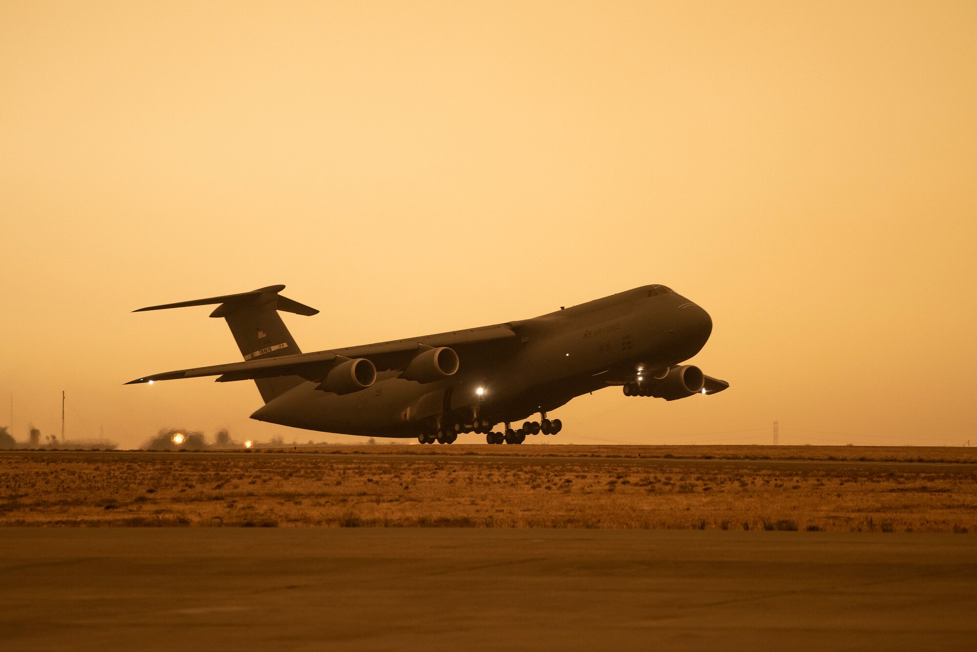 A C-5M Super Galaxy takes off at Travis Air Force Base, California, Sept. 9, 2020. Wildfires across California propelled smoke and ash into the troposphere, impacting air quality. (U.S. Air Force photo by Heide Couch)