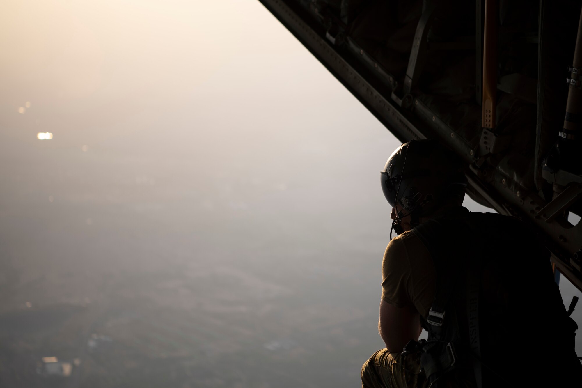 A person looks out a plane