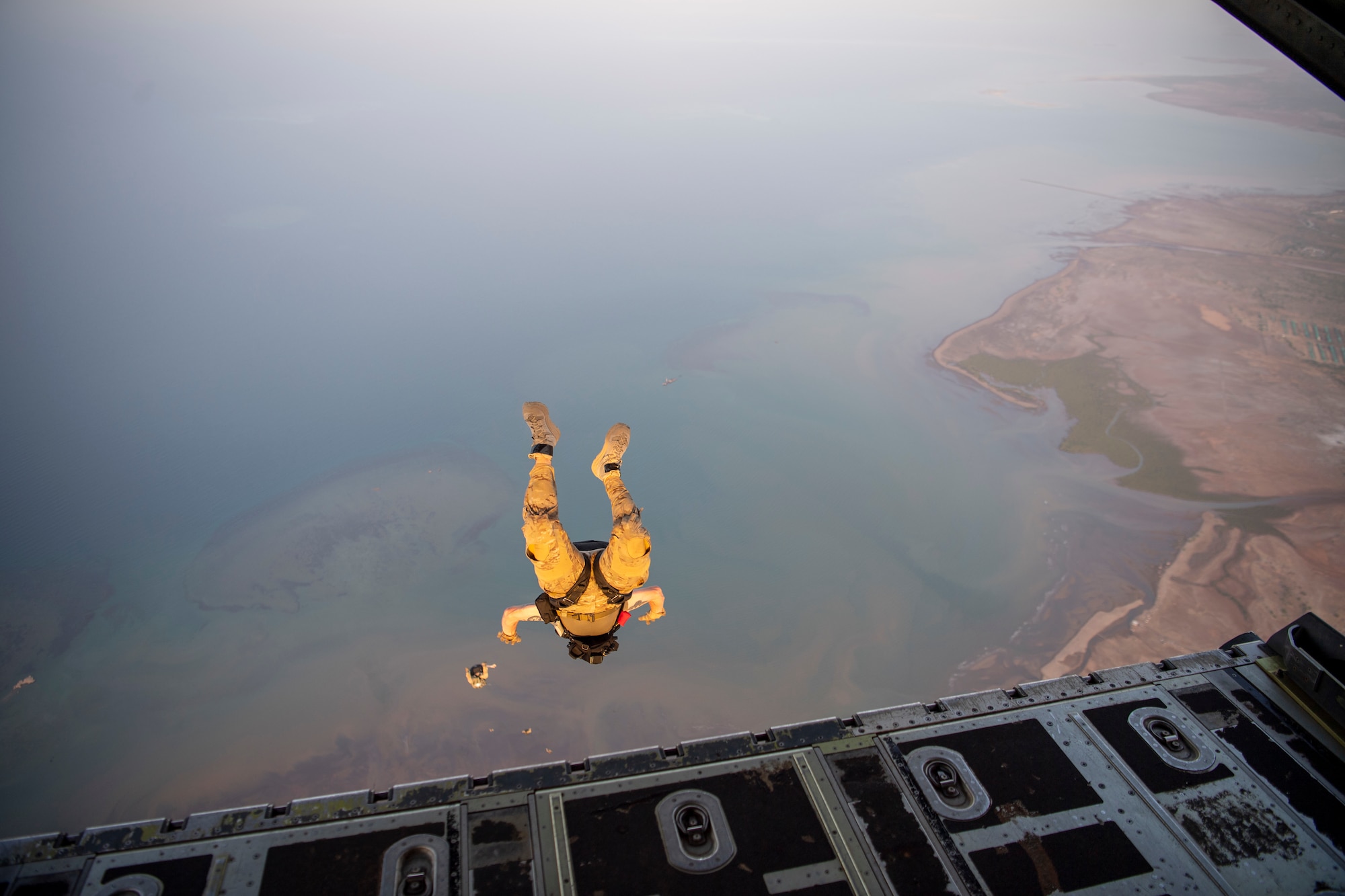 A person jumps from an airplane