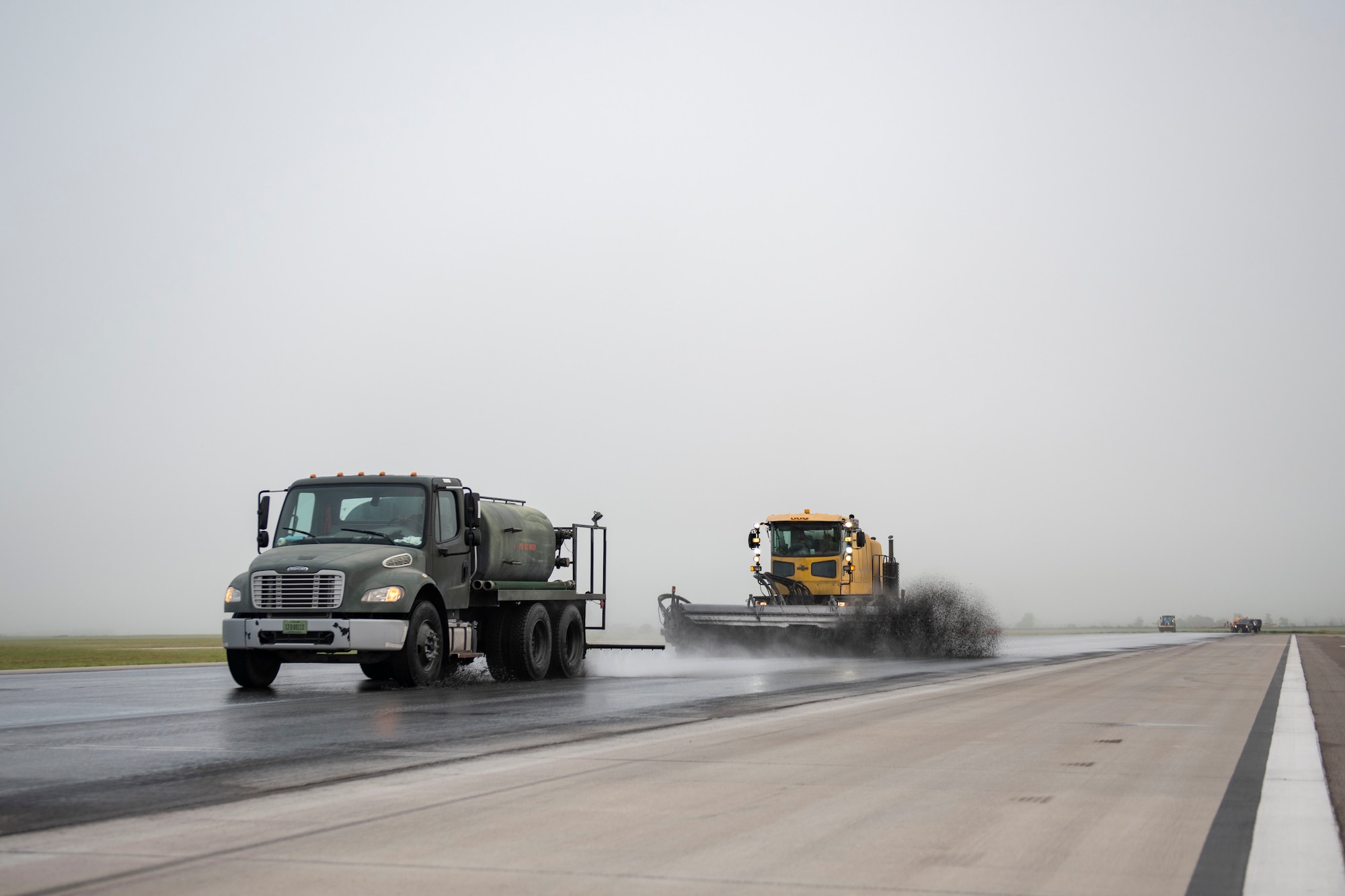 97th Civil Engineer Squadron removes runway rubber.