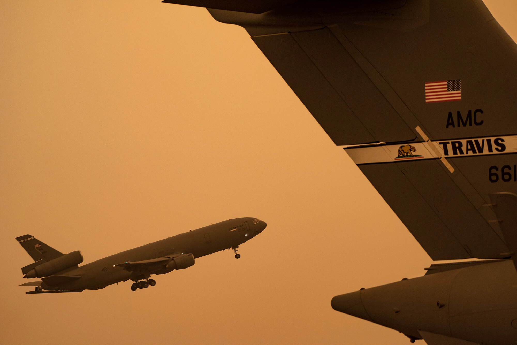 A KC-10 Extender takes off at Travis Air Force Base, California, Sept. 9, 2020. Wildfires across California propelled smoke and ash into the troposphere, impacting air quality. (U.S. Air Force photo by Heide Couch)