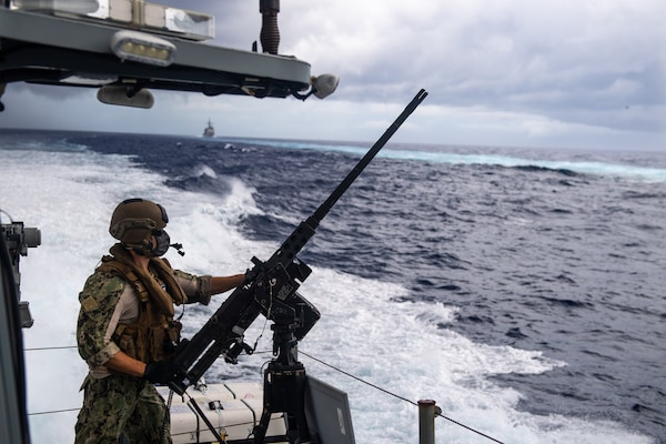 A Sailor assigned to Coastal Riverine Squadron 3, mans a .50-caliber machine gun while aboard a Mark VI patrol boat in support of Valiant Shield 2020.