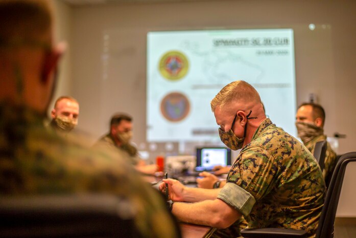 A U.S. Marine briefs task force leaders during a virtual team meeting at Camp Lejeune, N.C., May 29.