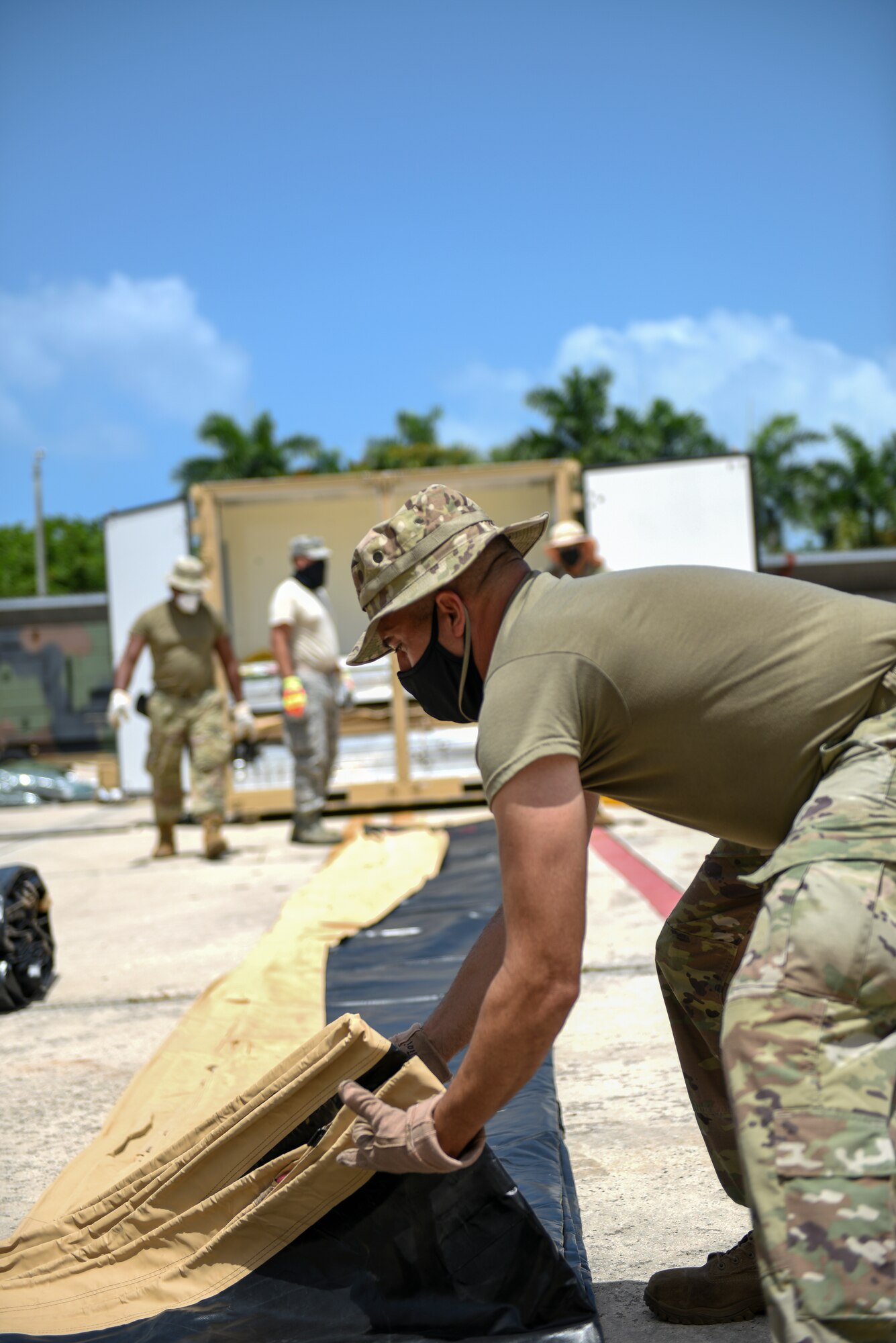 U.S. Airmen with the 156th Civil Engineer Squadron, Puerto Rico Air National Guard, set up tents and generators as part of a two week long training exercise on the Disaster Relief Beddown Systems at Muñiz Air National Guard Base, Aug. 18, 2020. Specialized Airmen from the New Mexico ANG, Arkansas ANG, Pennsylvania ANG, North Carolina ANG, Iowa ANG and Colorado ANG arrived at Muñiz to train Puerto Rico National Guard Airmen and Soldiers on how to properly assemble, operate, inventory and disassemble the DRBS equipment. (U.S. Air National Guard photo by Tech. Sgt. Rafael D. Rosa)