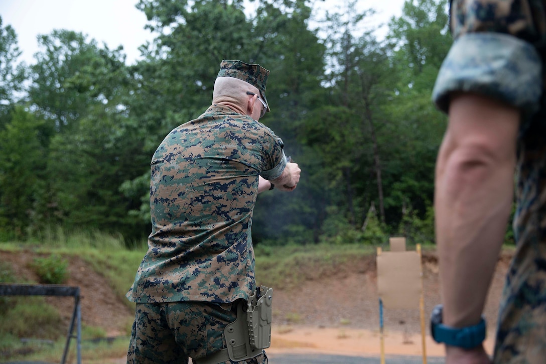The 19th Sergeant Major of the Marine Corps, Sgt. Maj. Troy E. Black, fires the Sig Sauer P320-M18 on a Weapon Training Battalion range at Marine Corps Base Quantico, V.A., Sept. 10, 2020. The purpose of the visit was to get a look at the capabilities of the Marine Corps’ newly adopted handgun through demonstrations from the Marine Corps Shooting Team and practical application. The M18 has replaced the Beretta M9 as the Marine Corp service pistol. (U.S. Marine Corps photo by Sgt. Victoria Ross)