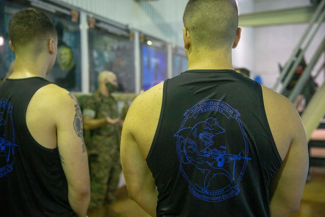 The 19th Sergeant Major of the Marine Corps, Sgt. Maj. Troy E. Black, greets Marine Corps Instructors of Water Survival at The Basic School (TBS) at Marine Corps Base Quantico, V.A., Sept. 10, 2020. The purpose of the visit was to look at the Officer Candidate training facilities and speak to the instructors responsible for facilitating countless hours of initial and annual training. The Fitness Center housed at TBS includes the only Force Fitness Instructor course in the Marine Corps. (U.S. Marine Corps photo by Sgt. Victoria Ross)