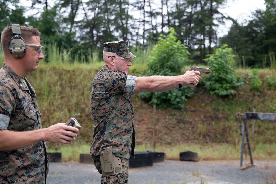 The 19th Sergeant Major of the Marine Corps, Sgt. Maj. Troy E. Black, fires the Sig Sauer P320-M18 on a Weapon Training Battalion range at Marine Corps Base Quantico, V.A., Sept. 10, 2020. The purpose of the visit was to get a look at the capabilities of the Marine Corps’ newly adopted handgun through demonstrations from the Marine Corps Shooting Team and practical application. The M18 has replaced the Beretta M9 as the Marine Corp service pistol. (U.S. Marine Corps photo by Sgt. Victoria Ross)