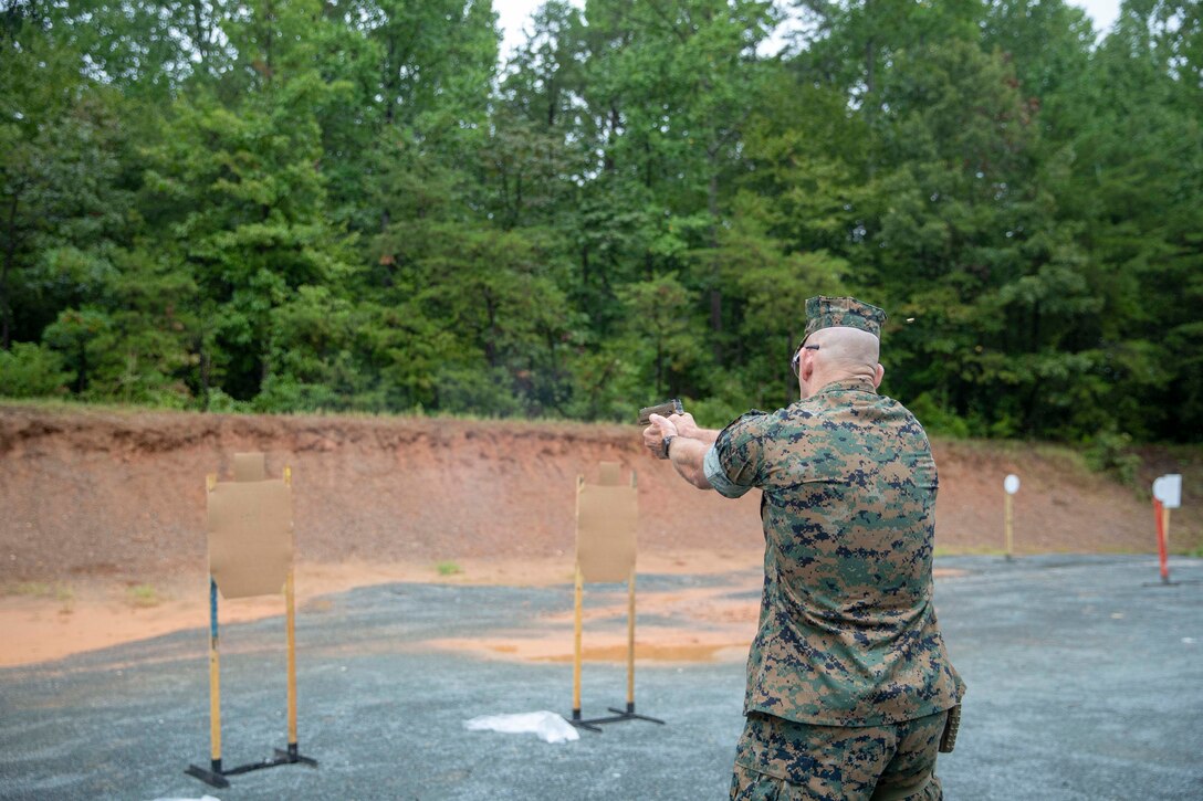The 19th Sergeant Major of the Marine Corps, Sgt. Maj. Troy E. Black, fires the Sig Sauer P320-M18 on a Weapon Training Battalion range at Marine Corps Base Quantico, V.A., Sept. 10, 2020. The purpose of the visit was to get a look at the capabilities of the Marine Corps’ newly adopted handgun through demonstrations from the Marine Corps Shooting Team and practical application. The M18 has replaced the Beretta M9 as the Marine Corp service pistol. (U.S. Marine Corps photo by Sgt. Victoria Ross)