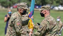 Army Col. Michael S. Hatfield receives the colors of the 100th Missile Defense Brigade (GMD) from Lt. Gen. Daniel L. Karbler, the commanding general of U.S. Army Space and Missile Defense Command, during a change of command ceremony at the Patriot Park Parade Field at Peterson Air Force Base, Aug. 31, 2020. Hatfield inherits command of the 100th Brigade from Col. Christopher M. Williams who had been in command since Dec. 7, 2017.  (U.S. Army National Guard photo by Staff Sgt. Zachary Sheely)