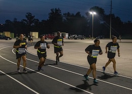 Soldiers with the 1st Theater Sustainment Command run laps during the Dedicate Your Run/Walk event Sept. 10, 2020 at Fort Knox, Kentucky. During the event, participants dedicated the number of miles they ran or walked to a survivor of sexual assault as a show of support. The event took place to raise awareness of the approximately 7825 cases of sexual assault and harassment across the Department of Defense.