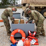 Mississippi Army National Guard Soldiers assigned to an engineer composite team pack supplies in preparation to conduct high-water rescues in response to Hurricane Sally at Camp Shelby Joint Force Training Center, Miss., Sept. 15, 2020. The Mississippi National Guard is prepared to conduct civil support operations, including search and rescue and debris removal, to support local and state authorities.