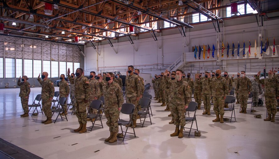 Photo of Airmen raising their hands during oath