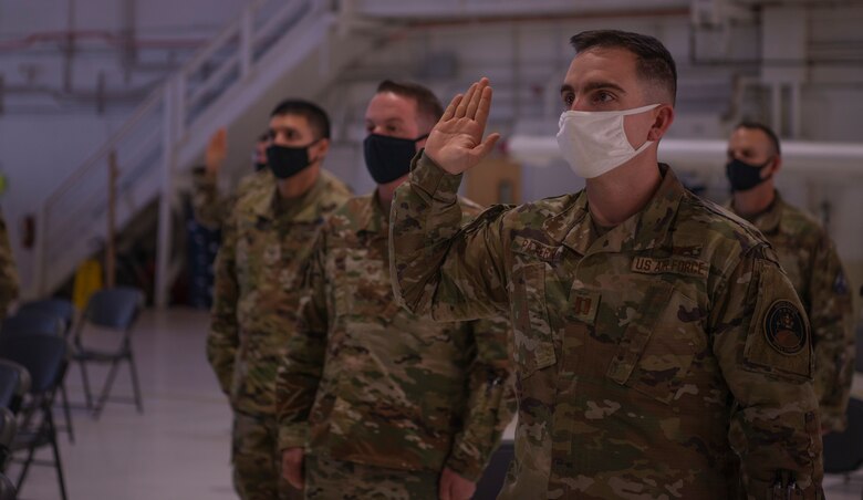 Photo of Airmen raising their hands during oath