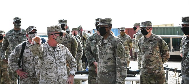 U.S. Marine Corps Gen. Kenneth F. McKenzie Jr., United States Central Command commander, talks to a group of Army Soldiers during a visit to the Alpha Battery 5-52 Air Defense Artillery Battalion, Sept. 13, 2020, at Al Dhafra Air Base, United Arab Emirates. CENTCOM maintains the capability to perform all critical missions in the region, ensuring the protection of U.S. forces, and takes all necessary measures to ensure the health and safety of the forces in the region. (U.S. Air Force photo by Tech. Sgt. Charles Taylor)