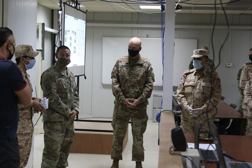 Brig. Gen. Thomas Spencer the 42nd Infantry Division Deputy Commander for Support listens to a summary of exercise Artillery Inferno II with Kuwait military Brig. Gen. Khaled Al-Shualah (right) September 10, 2020 in Kuwait. The exercise was centered on talking about the use of artillery for offensive and defensive purposes. (U.S. Army Photo by Sgt. Andrew Winchell)