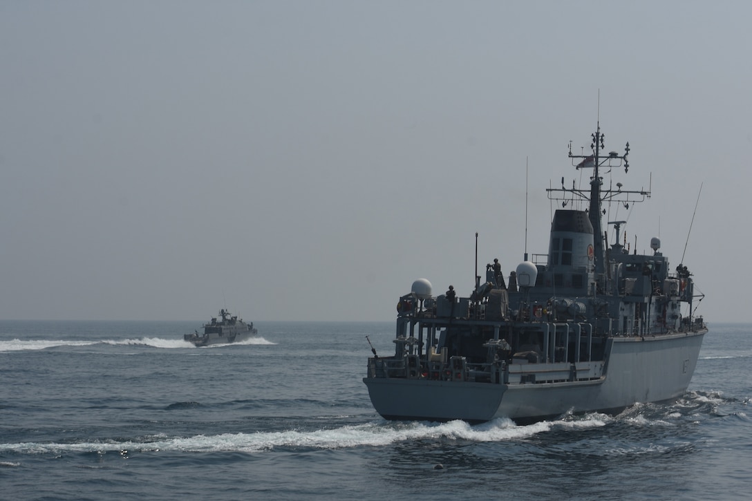 ARABIAN GULF (Sept. 10, 2020)  The Royal Navy Hunt-class mine countermeasures vessel HMS Chiddingfold (M37), right, sails in formation with a Mark VI patrol boat attached to Commander, Task Force (CTF) 56 during a bi-lateral mine countermeasure exercise between the U.K. and U.S. in the Arabian Gulf, Sept. 10.  CTF 56 is deployed to the U.S. 5th Fleet area of operations and conducts mine warfare operations in support of naval operations to ensure maritime stability in the Central Region, connecting the Mediterranean and Pacific through the Western Indian Ocean and three strategic chokepoints to the free flow of global commerce.  (U.S. Army photo by Staff Sgt. Timothy Clegg)