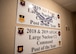 Signs commemorating the 2nd Bomb Wing command post's achievements hang at the entrance of the 2nd BW command post at Barksdale Air Force Base, La., Sept. 3, 2020. Barksdale's command post was awarded the 2018 and 2019 Air Force Global Strike Command Large Nuclear C2 Command Post of the Year as well as the 2019 Air Force Large NC2 Command Post of the Year. (U.S. Air Force photo by Airman 1st Class Jacob B. Wrightsman)