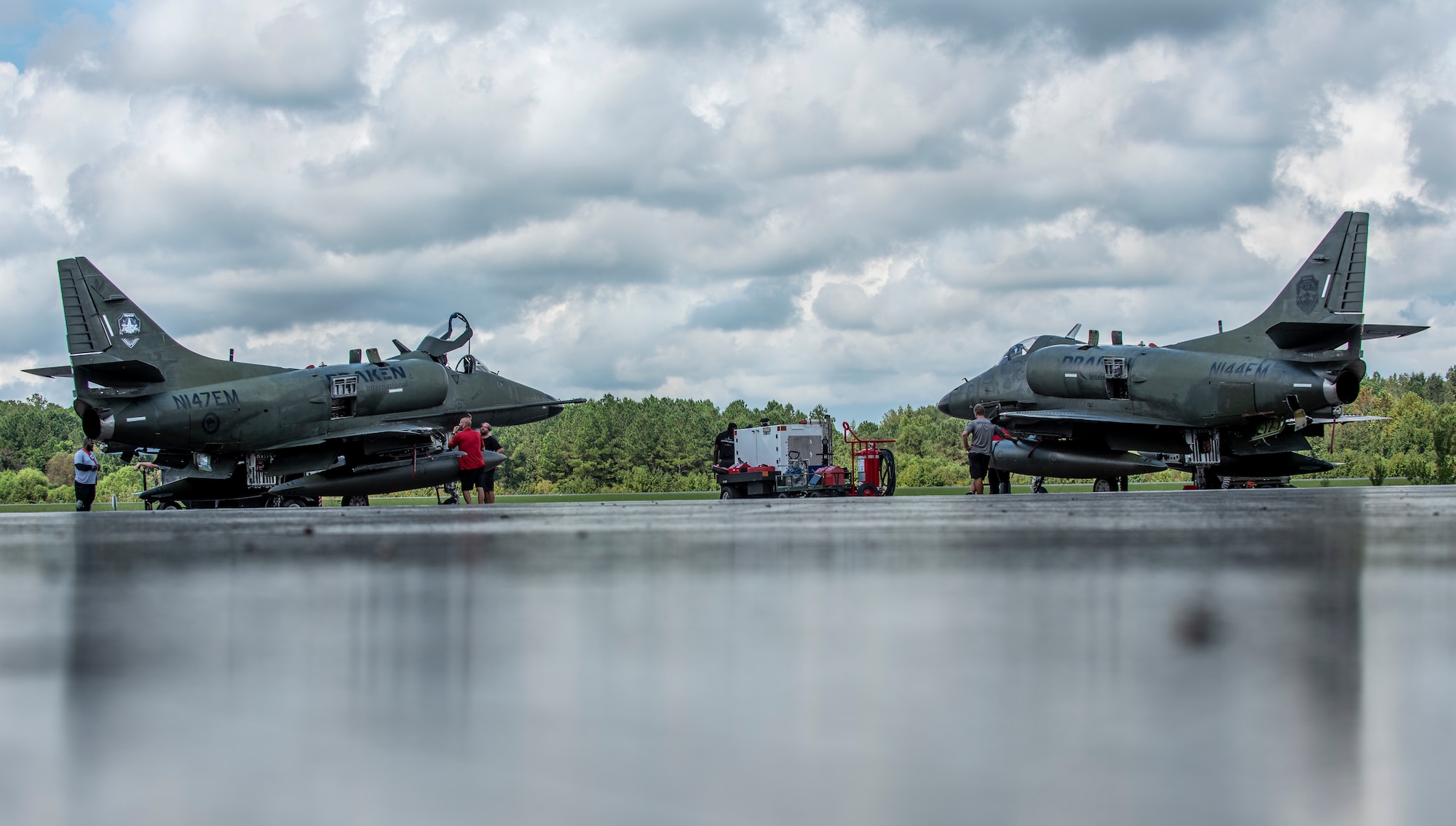 Maintainers at Draken International prepare A-K4 Skyhawks for flight at Kinston Regional Jetport, North Carolina Sept. 11, 2020. Draken provided a realistic aerial training environment to F-15E Strike Eagle aircrew members at Seymour Johnson Air Force Base. (U.S. Air Force photo by Airman 1st Class Kimberly Barrera)