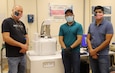 Jack Worthington Jr, Dorian Lucero, Jonathan Ramirez in front of scanning electron machine