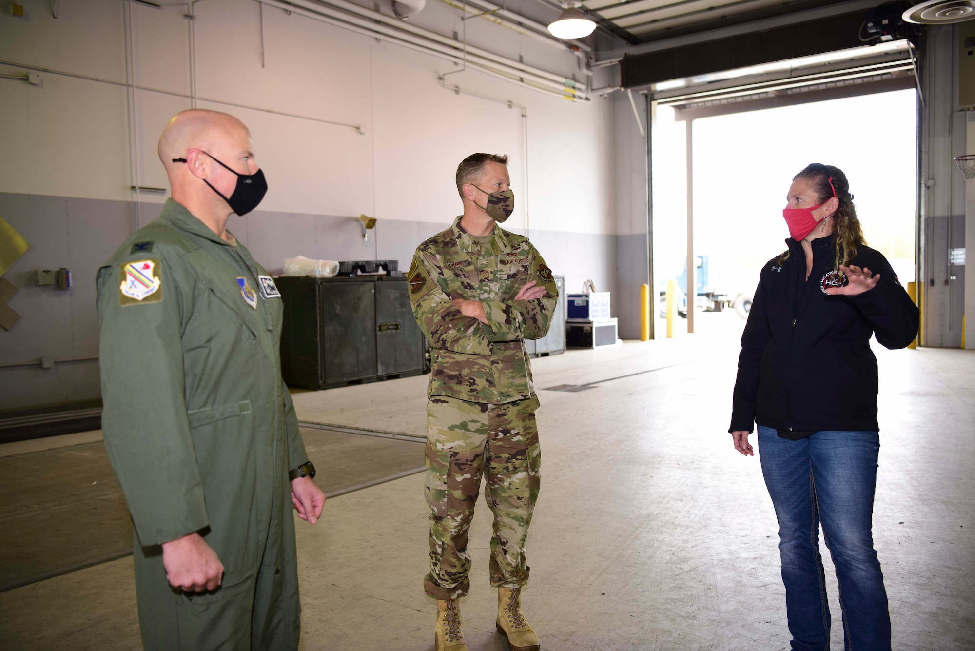 Holly Kinsey, the 354th Logistics Readiness Squadron (LRS) installation deployment, brief U.S. Air Force Col. David Berkland, the 354th Fighter Wing (FW) commander, and Chief Master Sgt. John Lokken, the 354th FW command chief, during a wing leadership immersion at Eielson Air Force Base, Alaska, Sept. 15, 2020.