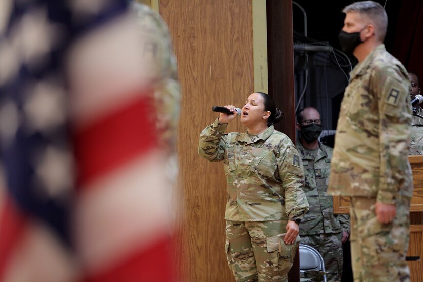 Staff Sgt. Natalie Romero, 5th Armored Brigade, sings the National Anthem during a Transfer of Authority ceremony at Fort Bliss, Texas, September 11, 2020.