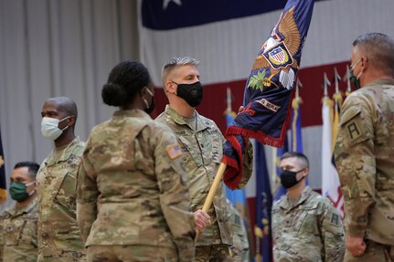 Lt. Col. Brian Wojtasiak, Commander of “Viper 9” and the CONUS Replacement Center, receives the Colors during a Transfer of Authority ceremony at Fort Bliss, Texas, September 11, 2020.