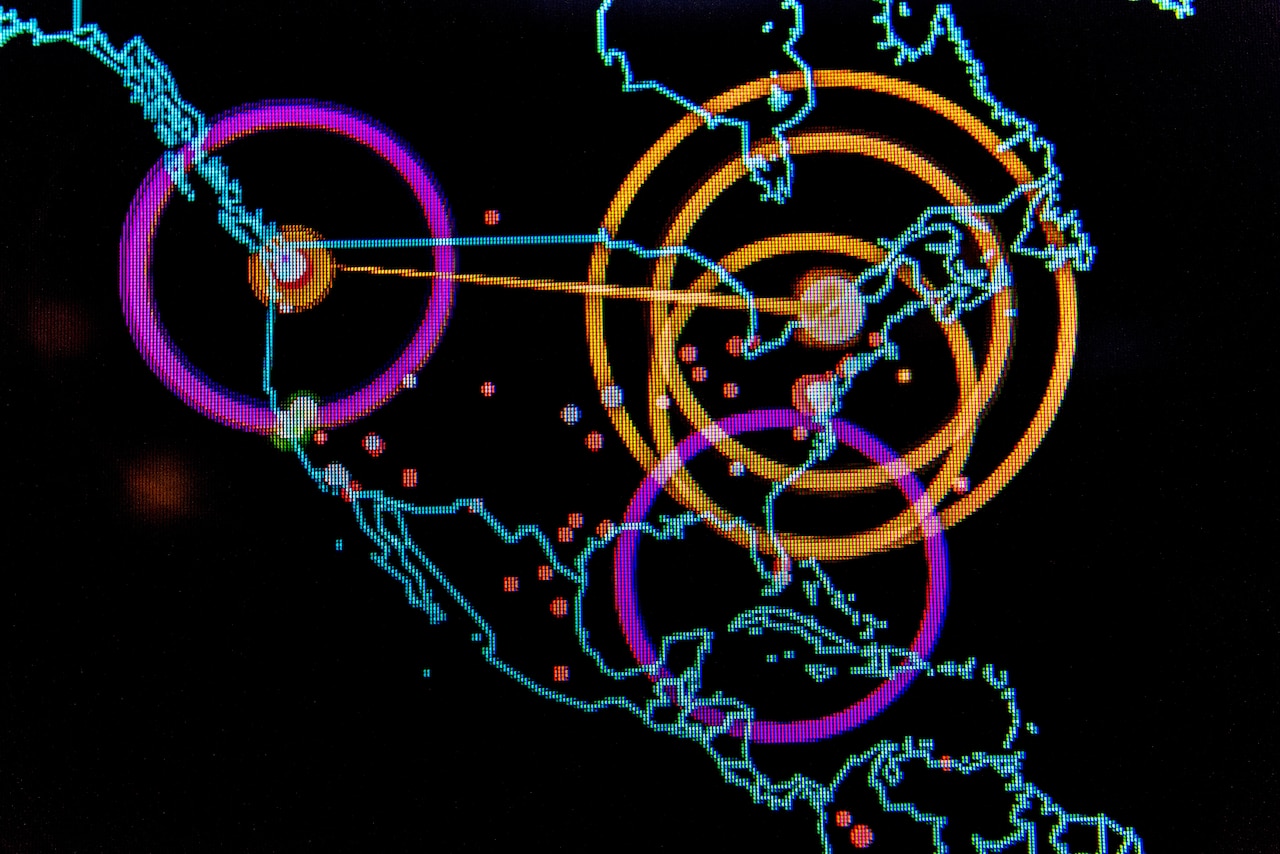 A graphic, computer-generated line map of the world highlights points of cyber activity.