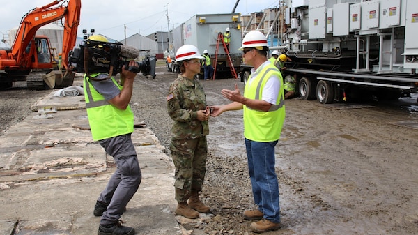 Tim Gouger (right) program manager, Rapid Response, Omaha District Technical Center of Expertise, speaks with Brig. Gen. Diana Holland, USACE South Atlantic Division Commander,at the Palo Seco power plant in Puerto Rico, Dec. 2017.  The rapid response team assisted with setting up two backup mega generators to provide temporary power in the aftermath of hurricane Maria in Sept. 2017.