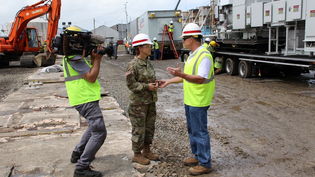Tim Gouger (right) program manager, Rapid Response, Omaha District Technical Center of Expertise, speaks with Brig. Gen. Diana Holland, USACE South Atlantic Division Commander,at the Palo Seco power plant in Puerto Rico Dec. 2017.  The rapid response team assisted with setting up two backup mega generators to provide temporary power in the aftermath of hurricane Maria in Sept. 2107.
