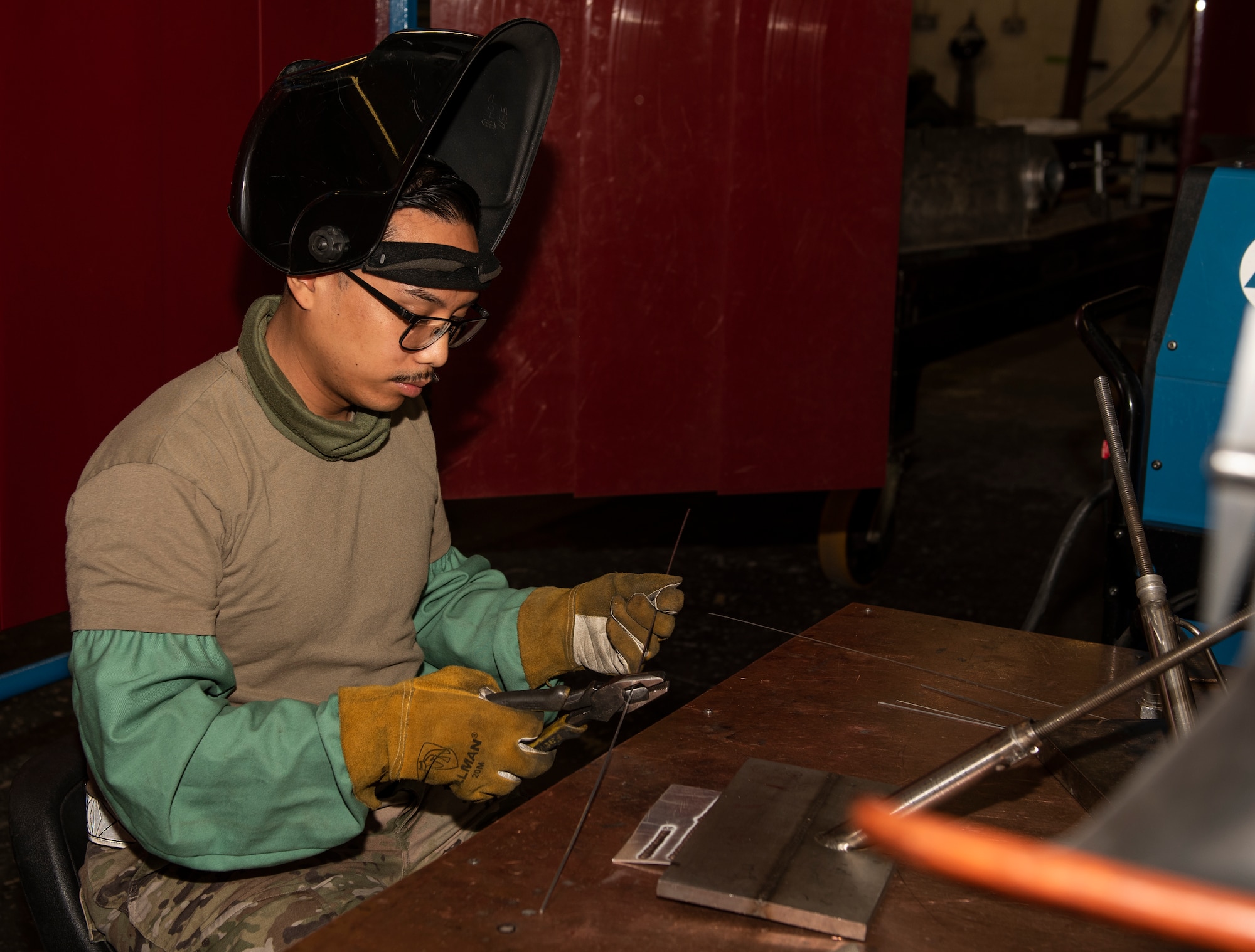 U.S. Air Force Staff Sgt. Richard Ababan, 48th Equipment Maintenance Squadron Fabrication Flight, conducts his tungsten inert gas (TIG) welding certification at Royal Air Force Lakenheath, England Sept. 15, 2020. The Fabrication Flight maintains the structural integrity of aircraft using specialized tools and equipment to repair damage and fabricate replacement parts, ensuring the 48th Fighter Wing remains a ready and capable force. (U.S. Air Force photo by Airman 1st Class Jessi Monte)