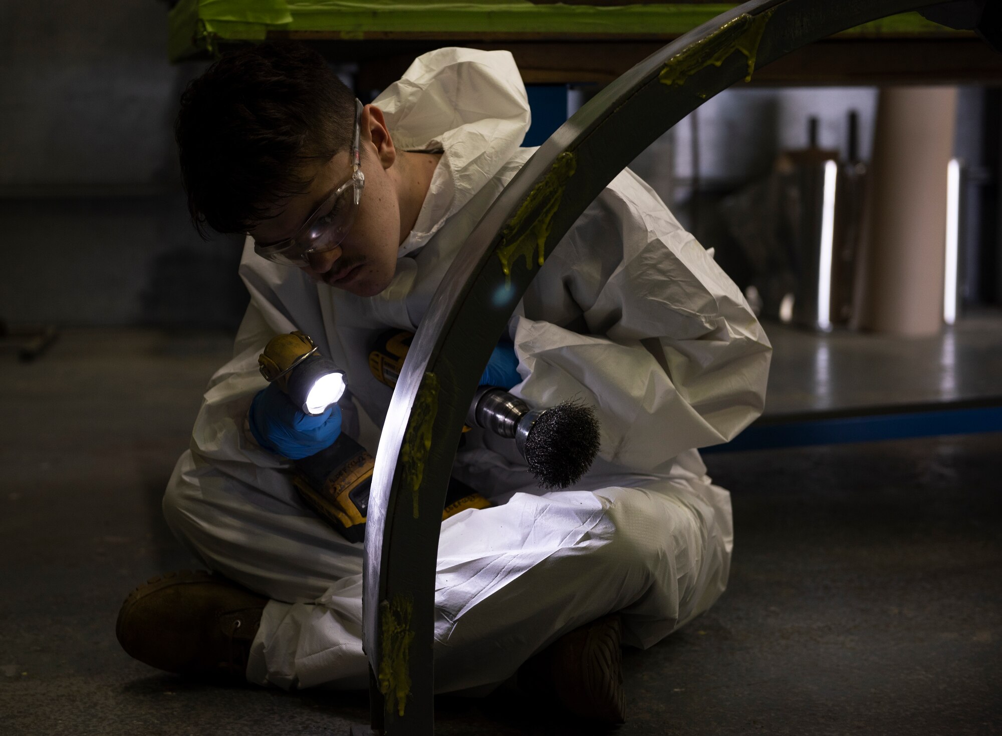 Senior Airman Tristan Casner, 48th Equipment Maintenance Squadron Fabrication Flight, inspects an aircraft component at Royal Air Force Lakenheath, England, Sept. 15, 2020. The Fabrication Flight maintains the structural integrity of aircraft using specialized tools and equipment to repair damage and fabricate replacement parts, ensuring the 48th Fighter Wing remains a ready and capable force. (U.S. Air Force photo by Airman 1st Class Jessi Monte)