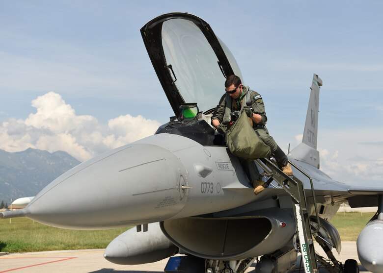 U.S. Air Force Maj. John Hamilton, 555th Fighter Squadron assistant director of operations, prepares for a flight during exercise Point Blank at Aviano Air Base, Italy, Sept. 10, 2020. The 555th FS participated in Point Blank 20-4 for the first time this year. (U.S. Air Force photo by Staff Sgt. Heidi Goodsell)