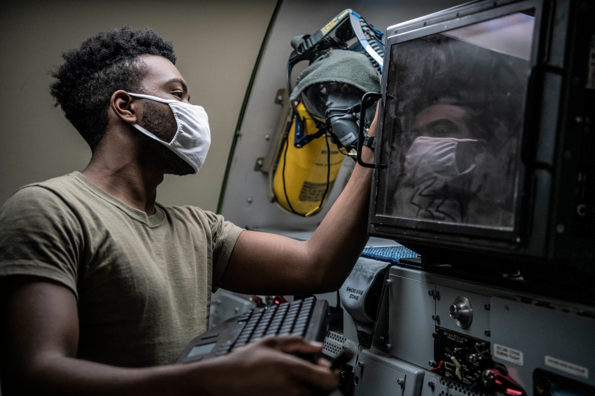 Lieutenant Col. Jeff Waterman, 968th Expeditionary Airborne Air Control Squadron, 968 EAACS director of operations, performs a pre-flight check on his oxygen mask before take-off at Al Dhafra Air Base, United Arab Emirates Sept. 15, 2020. Deployed Airmen from the 968 EAACS provide continuous Battle Management Command and Control for over 5,000 aircraft to include Defensive Counter Air, Close Air Support, Remotely Piloted Aircraft, Tanker, and Intelligence, Surveillance, and Reconnaissance assets. (U.S. Air Force photographer by Master Sgt. Patrick OReilly)