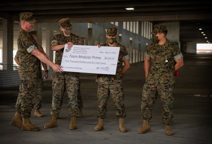 U.S. Marines hold a cash prize during an award ceremony at Camp Lejeune, N.C., Sept. 15.