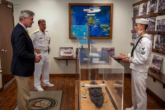 Secretary of the Navy (SECNAV) Kenneth J. Braithwaite tours the Commander, U.S. Pacific Fleet (PACFLT) boathouse museum in Pearl Harbor, Hawaii.