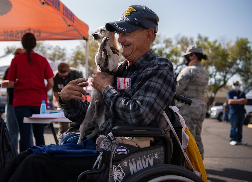 Donald, retired, waits for his dog, Riley, to receive care from the Street Dog Coalition volunteers at the 22nd Annual Homeless Veteran Stand Down in downtown Colorado Springs, Colorado, Sept. 15, 2020. The Street Dog Coalition volunteers performed a wellness check on Riley, which included giving him vaccines, testing him for heartworms and providing him with flea medication and a new stuffed toy. (U.S. Air Force photo by Airman 1st Class Amanda Lovelace)
