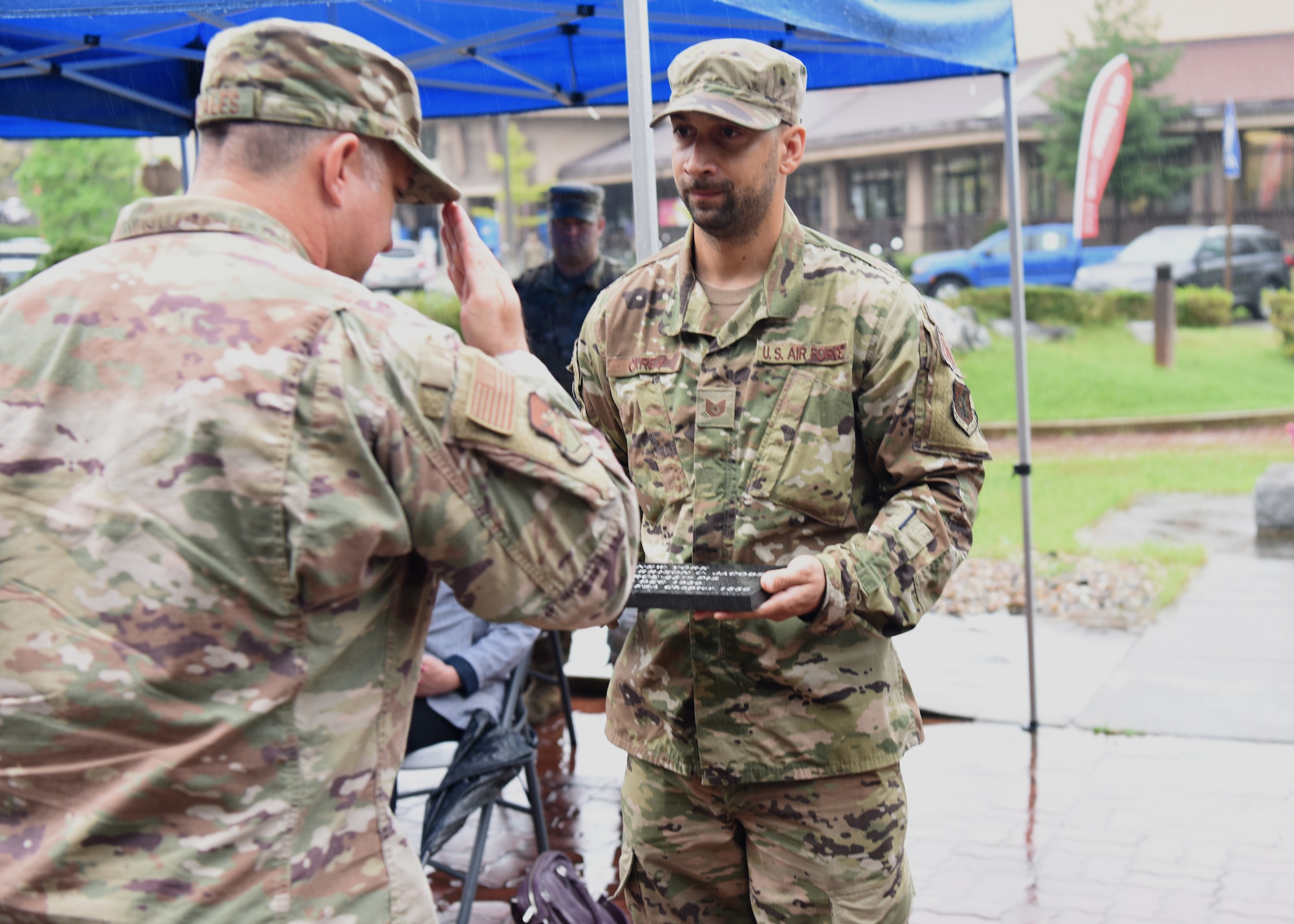 Colonel John Gonzales, 51st Fighter Wing commander, salutes a commemorative brick during a POW/MIA Recognition Day ceremony at Osan Air Base, Republic of Korea, Sept. 16, 2020. The brick was dedicated to 1st Lt. Jacob Harrison, a pilot with the 25th Fighter Interceptor Squadron, who was declared missing in action after his aircraft was shot down over the Pacific Ocean during the Korean War. (U.S. Air Force photo by Senior Airman Denise Jenson)