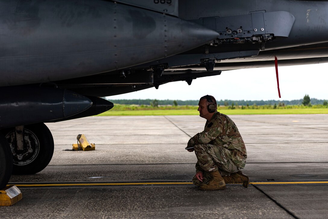 Photo of Airman evaluating an Airman.