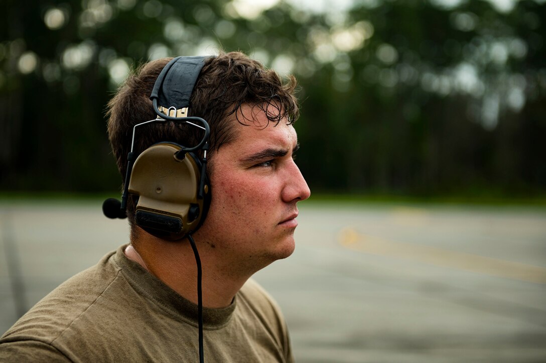 Photo of Airman looking out to an F-15E.