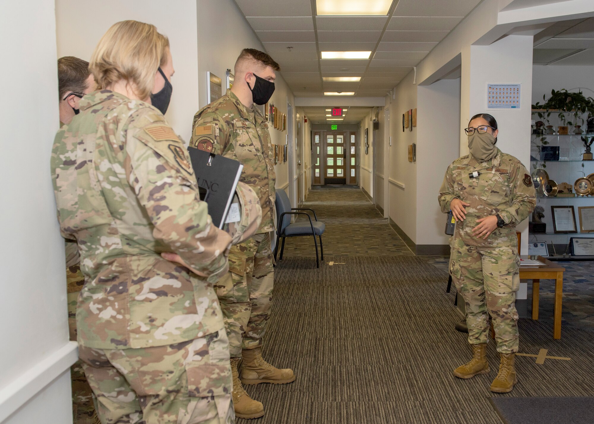 U.S. Air Force Airman Alea Drake, a 673d Aerospace Medicine Squadron bioenvironmental engineering apprentice, briefs U.S. Air Force Col. Kirsten Aguilar, Joint Base Elmendorf-Richardson and 673d Air Base Wing commander, on the process of gathering  air quality readings during a 673d AMDS immersion tour at JBER, Alaska, Sept. 8, 2020. Aguilar familiarized herself with the 673d AMDS and its role in supporting readiness after  taking command of the installation July 14, 2020. The 673d AMDS maintains preventive medicine for the installation as well as flight readiness for the flying squadrons.