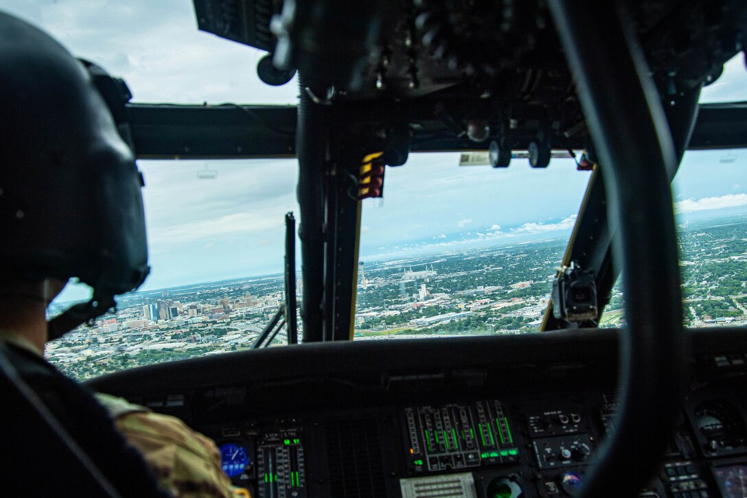 The San Antonio skyline is seen from the cockpit of a helicopter.