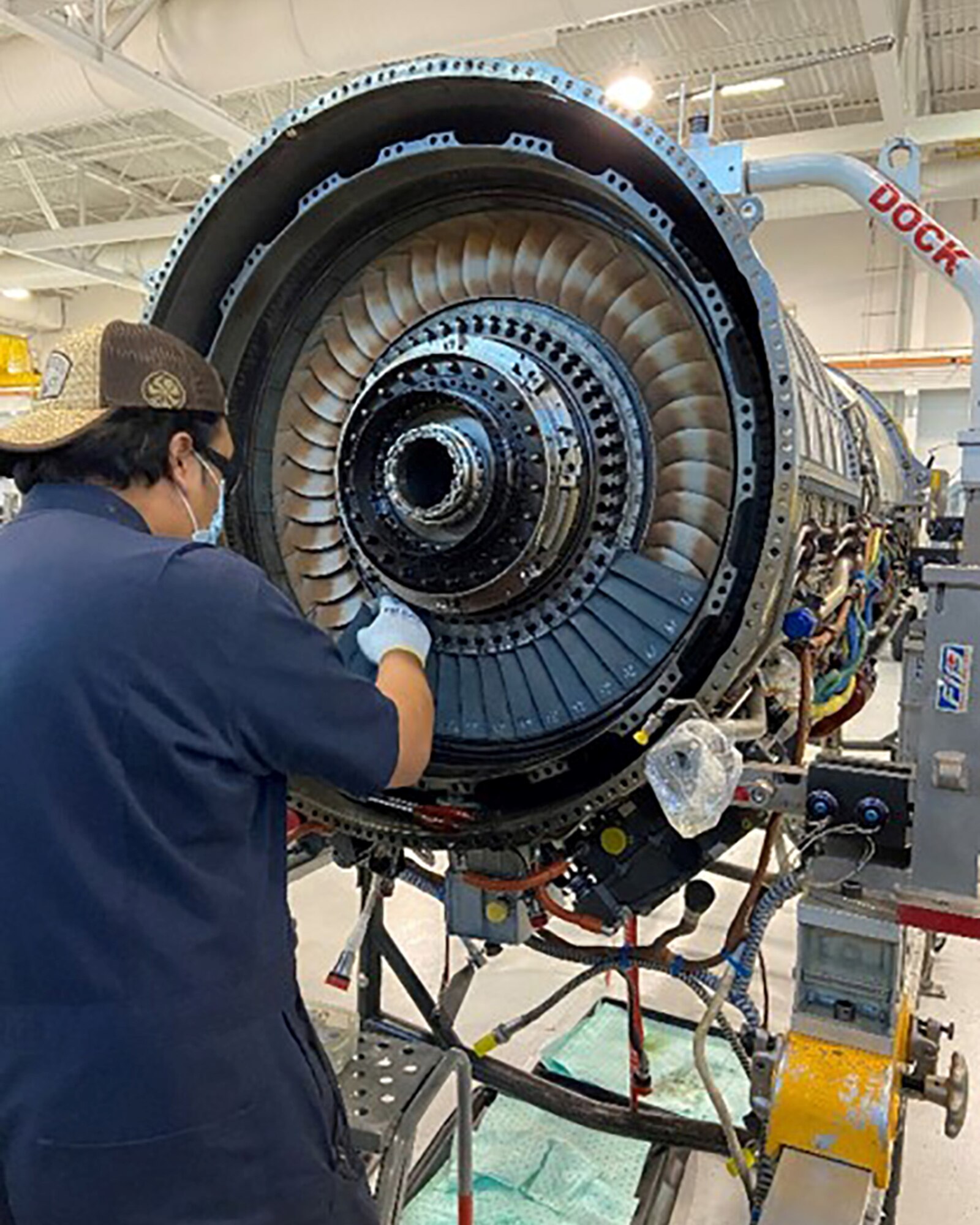 Brendan Gaarde, a contractor, installs a new blade in a low-pressure turbine in the F-22 Raptors at Joint Base Elmendorf-Richardson, Alaska, Sept. 17, 2020.