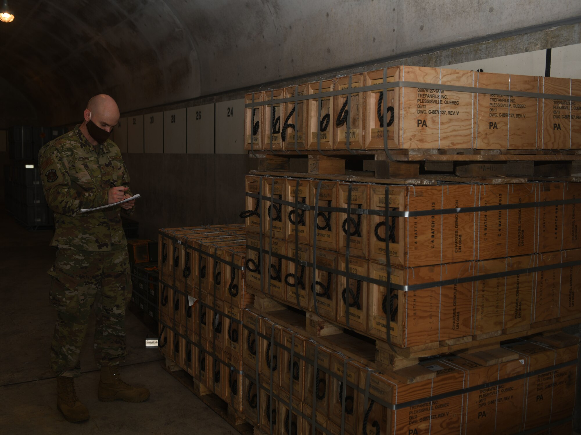 Airman counts munitions.