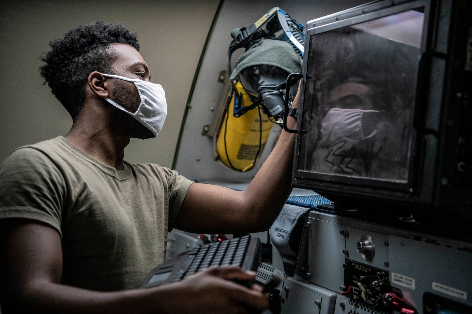 Lieutenant Col. Jeff Waterman, 968th Expeditionary Airborne Air Control Squadron, 968 EAACS director of operations, performs a pre-flight check on his oxygen mask before take-off at Al Dhafra Air Base, United Arab Emirates Sept. 15, 2020. Deployed Airmen from the 968 EAACS provide continuous Battle Management Command and Control for over 5,000 aircraft to include Defensive Counter Air, Close Air Support, Remotely Piloted Aircraft, Tanker, and Intelligence, Surveillance, and Reconnaissance assets. (U.S. Air Force photographer by Master Sgt. Patrick OReilly)