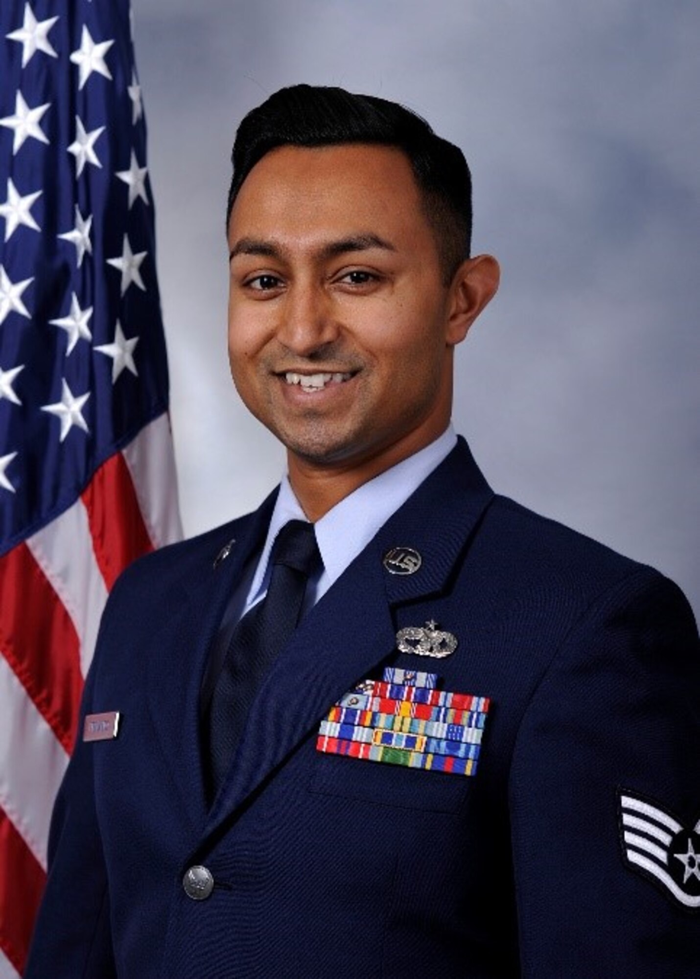 Staff Sgt. Emesh Fernando, Qualification Training Package Manager, Air Transportation Section, 423rd Mobility Training Squadron, poses for an official photo. On Sept. 10 he performed lifesaving actions to save am eight-year-old child from choking in Clementon, New Jersey. (Courtesy Photo)